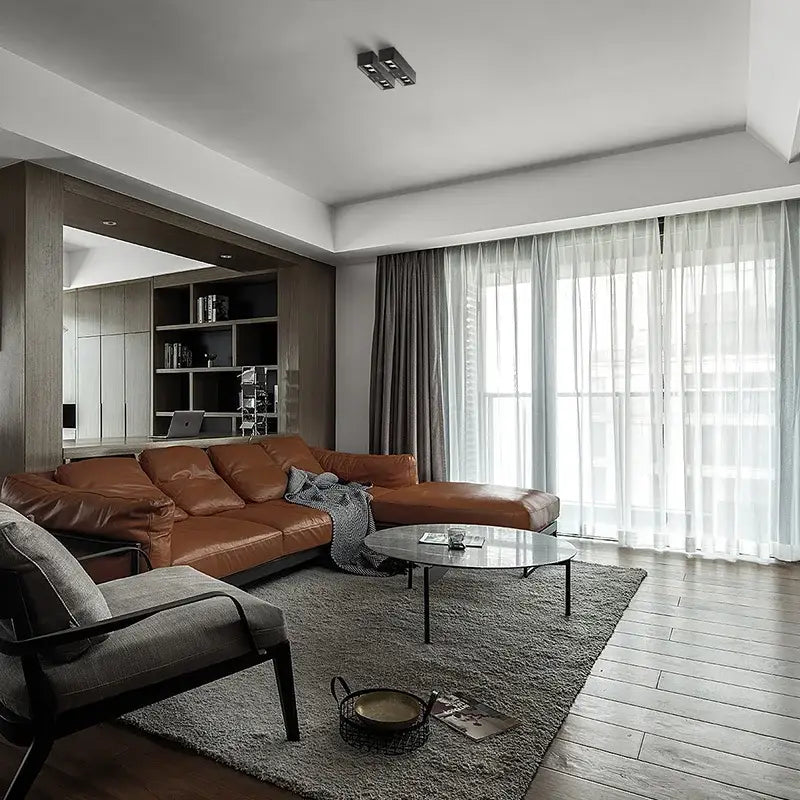 Brown leather sectional sofa with plush texture shown alongside modern white and gold 24w cri97 square led surface mount downlight