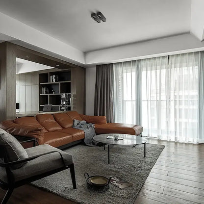 Brown leather sectional sofa with plush texture shown alongside modern white and gold 24w cri97 square led surface mount downlight