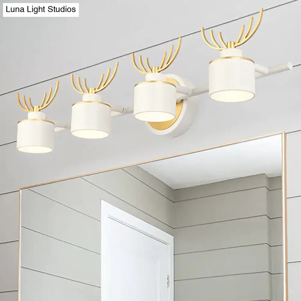 Modern white and gold antler wall light fixture with cylindrical vanity lights on a sleek bathroom track for natural light