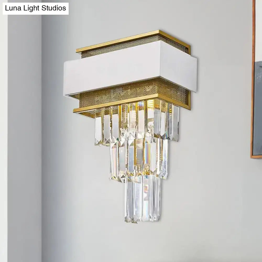 Modern white and gold wall sconce with crystal prisms mesh detailing as a stylish wall lamp for bedroom use