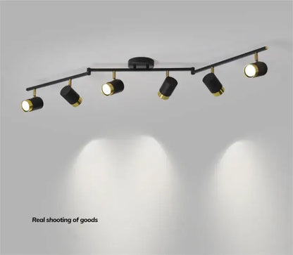Modern white and gold decorbites ceiling chandelier spotlight with black matte body and polished brass accents