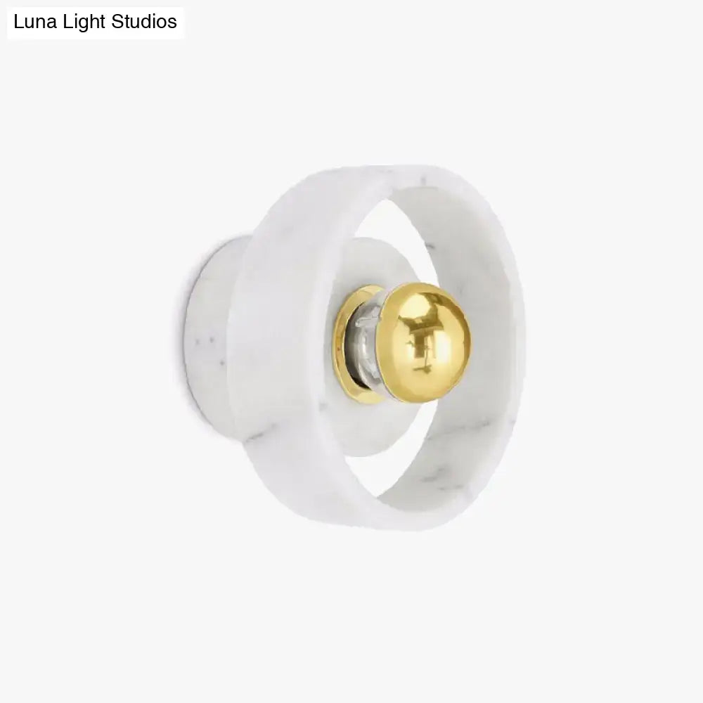 Modern white marble designer wall sconce with polished gold spherical accent perfect for bedroom lighting