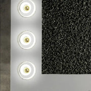 A sleek modern white and gold designer wall led light panel with three circular warm glow fixtures for bedroom use