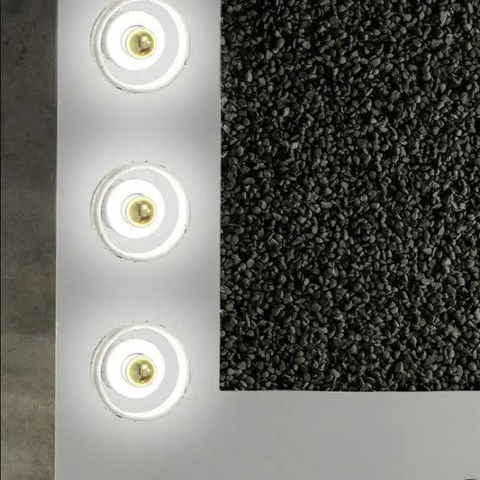 A sleek modern white and gold designer wall led light panel with three circular warm glow fixtures for bedroom use