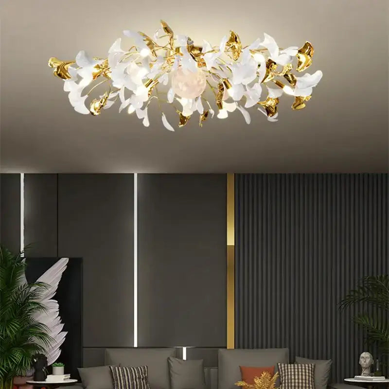 Modern white and gold ginkgo leaf led ceiling chandelier with a central pinkish orb for living room lighting