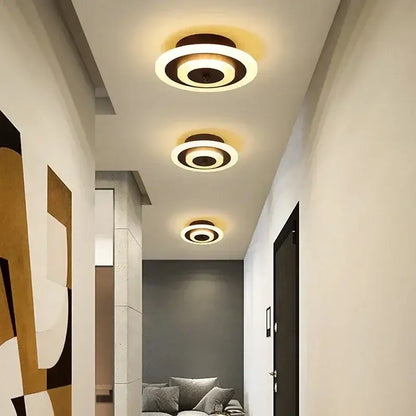 Modern white and gold led ceiling light with concentric warm white rings and dark bronze finish by decorbites led ceiling
