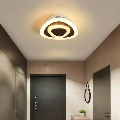 Modern white and gold led ceiling light with concentric rings emitting a warm glow by decorbites ceiling light