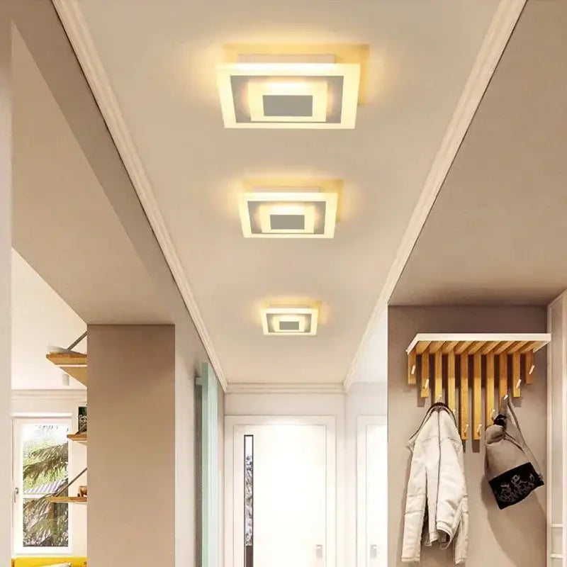 Modern white and gold led ceiling light with warm glowing illumination and layered geometric design for decorbites led ceiling