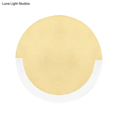 Gold-colored circular cushion with white adhesive border for modern white and gold round acrylic wall sconce warm white light