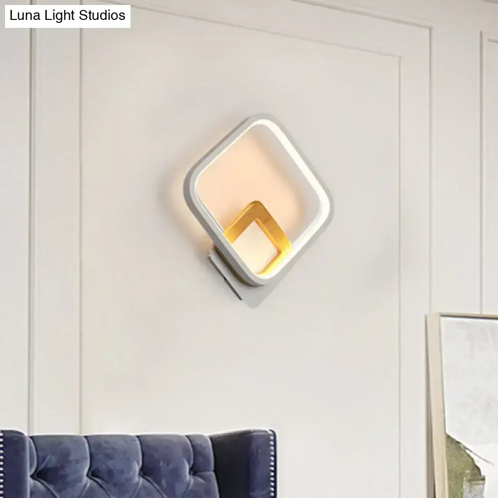 Modern white and gold wall sconce minimalist with sleek frame and warm white gold interior for bedroom lighting