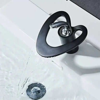 Black matte-finish snake-shaped basin faucet with polished chrome spout and handle for decorbites golden white sink