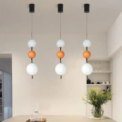 Modern white and gray glass pendant light with decorbites colorful ball led featuring black mounts and three spherical globes