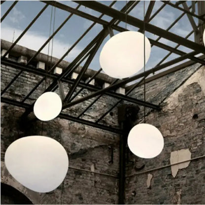Modern white gregg glass suspension pendant lights hang from a metal ceiling structure in a villa staircase decorbites pendant light