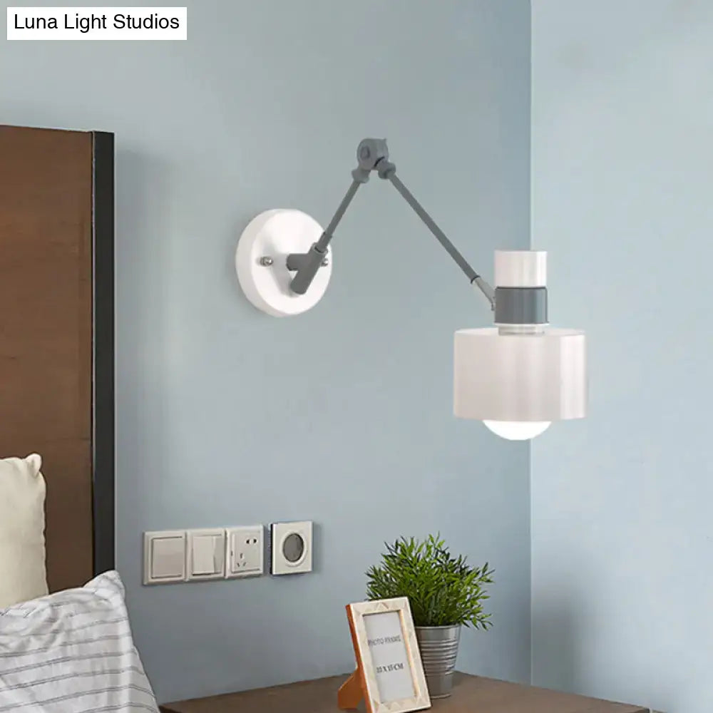 Modern white and grey adjustable wall sconce light with circular base, articulated arm, and frosted glass shade for bedroom
