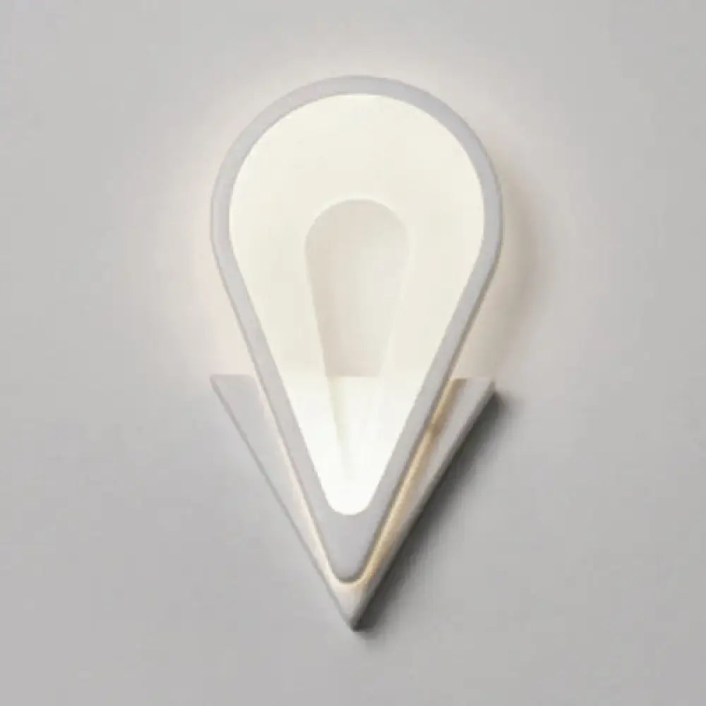 Modern white heart led wall sconce with a sleek teardrop design and layered geometric accents for minimalist bedrooms