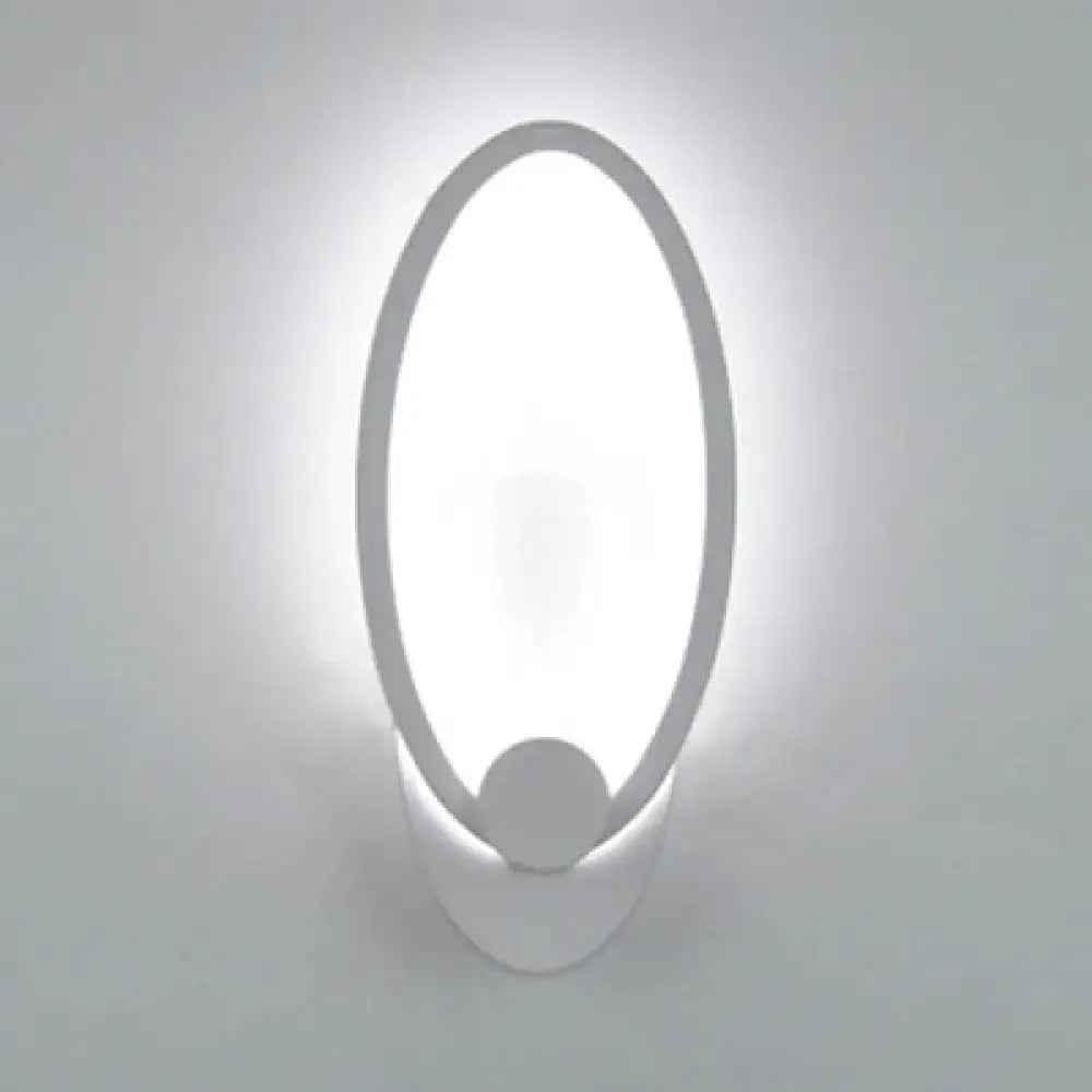 Modern white heart LED wall sconce with oval shape and sleek minimalist design for bedroom lighting