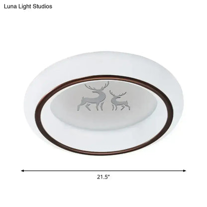 White oval LED ceiling light with bronze rim and frosted glass featuring etched deer and hot air balloon designs