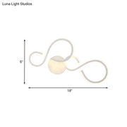 Modern white infinity spiral led light with sleek curved arms and warm glow bulb included for living room use