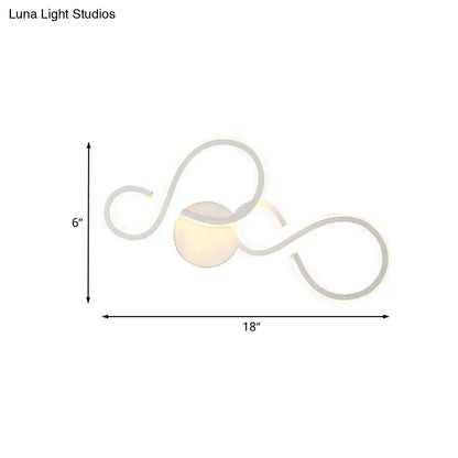 Modern white infinity spiral led light with sleek curved arms and warm glow bulb included for living room use