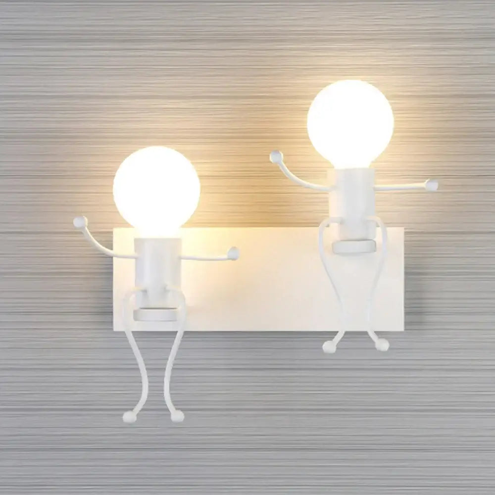 Modern white iron man cartoon wall sconce featuring two whimsical stick-figure characters with glowing bulb heads