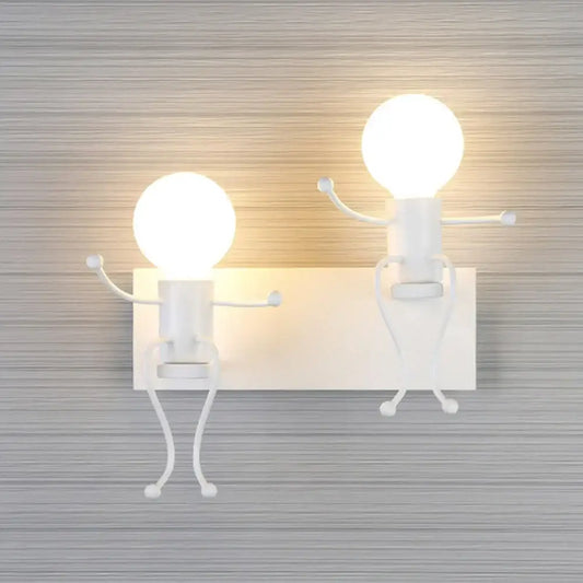 Modern white iron man cartoon wall sconce featuring two whimsical stick-figure characters with glowing bulb heads