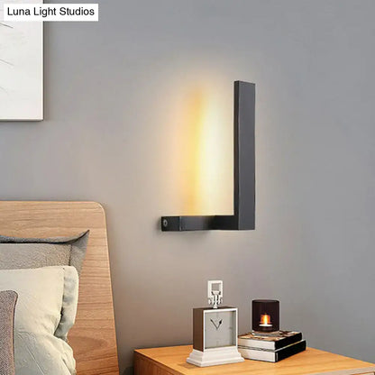 Modern black metal l-shaped led wall sconce with warm diffused light for living room geometric lighting