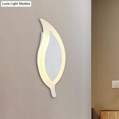 Modern white leaf wall lamp with a sleek frame and warm led lighting for bedroom use as a leaf wall lamp