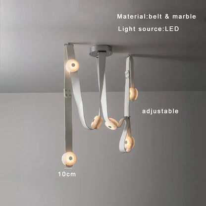 Adjustable modern pendant lights with white leather designer belt and marble accent featuring warm LED bulbs