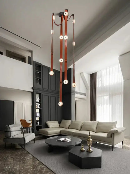 A modern villa chandelier with white leather designer belt straps and circular marble pendant lights decorbites designer belt