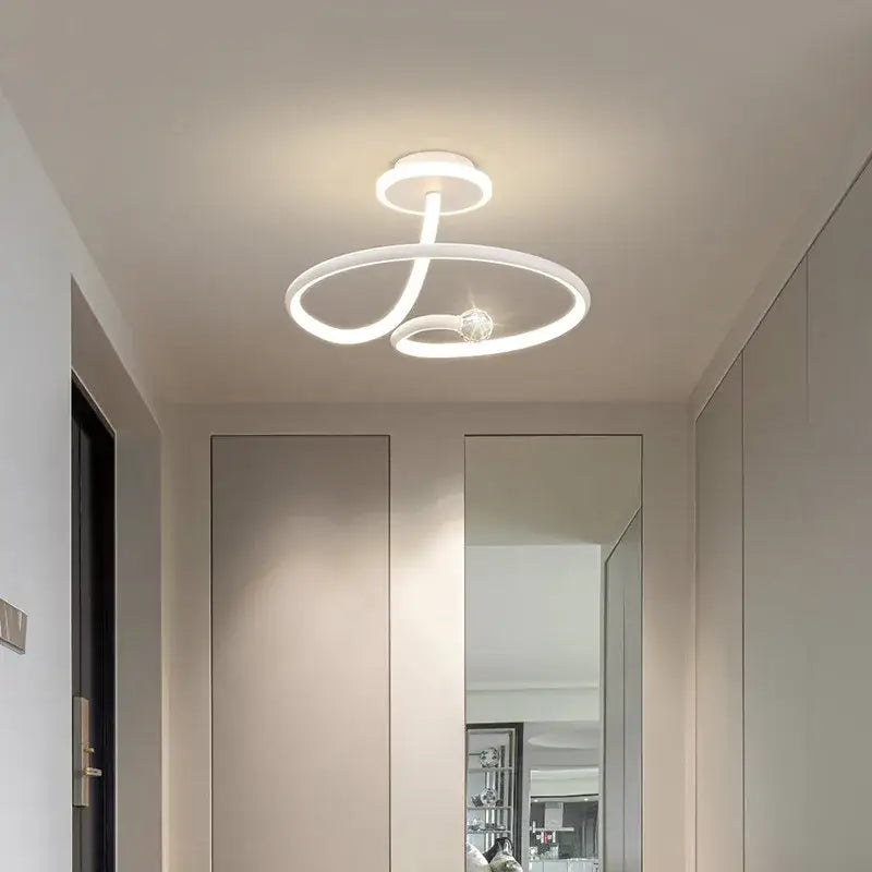 Modern white led ceiling light chandelier with sleek intertwined circular design and central crystal for living room decorbites led ceiling