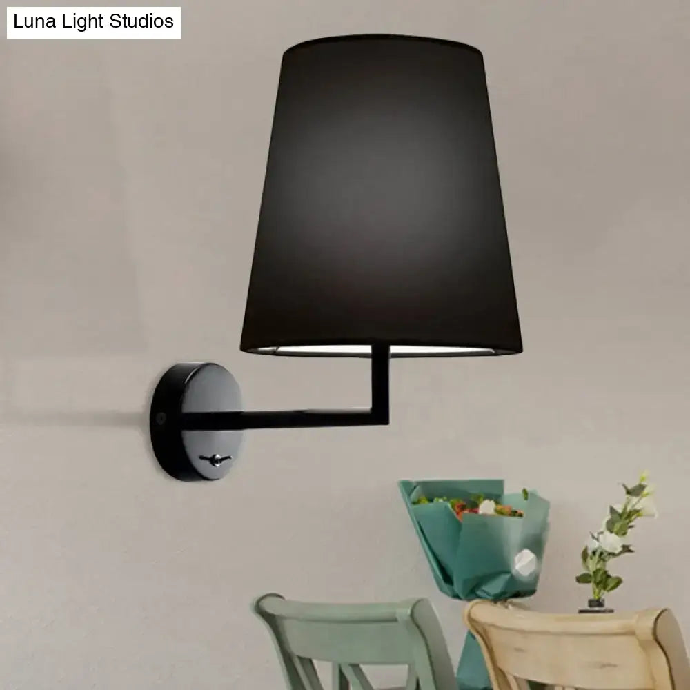 Black drum fabric lampshade on sleek adjustable black wall mounted led cone wall sconce for modern living rooms