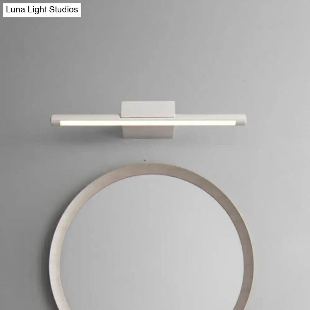 Modern white led vanity lamp with acrylic shade and sleek rectangular design emitting warm white light for bathroom wall use