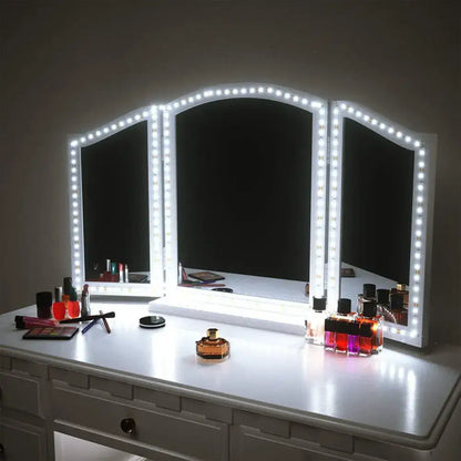 Modern white three-panel vanity mirror with led lights and vanity strip wall light for bathroom lighting