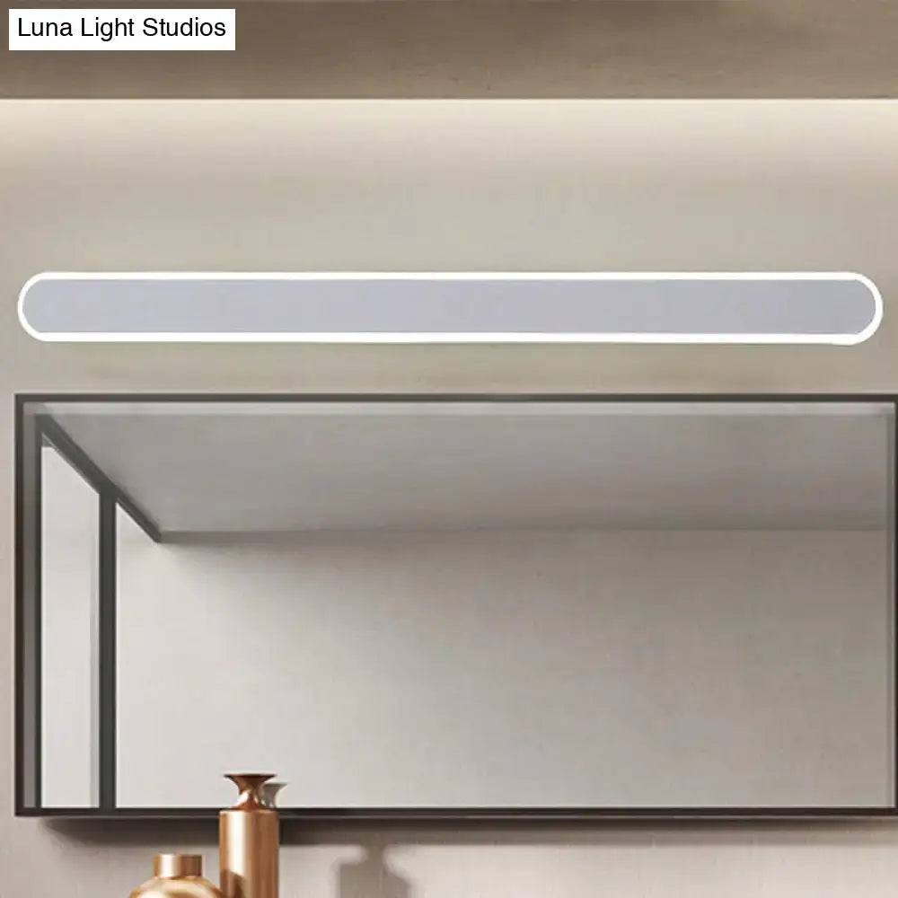 Modern white led wall light fixture with sleek minimalist design and rounded edges mounted above bathroom mirror