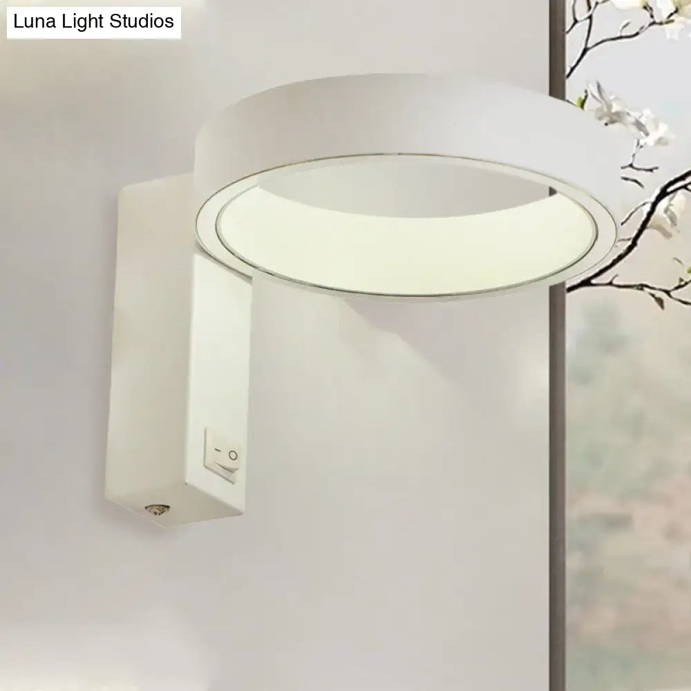 Modern white led wall sconce with sleek minimalist design and direct wired power source for living room lighting