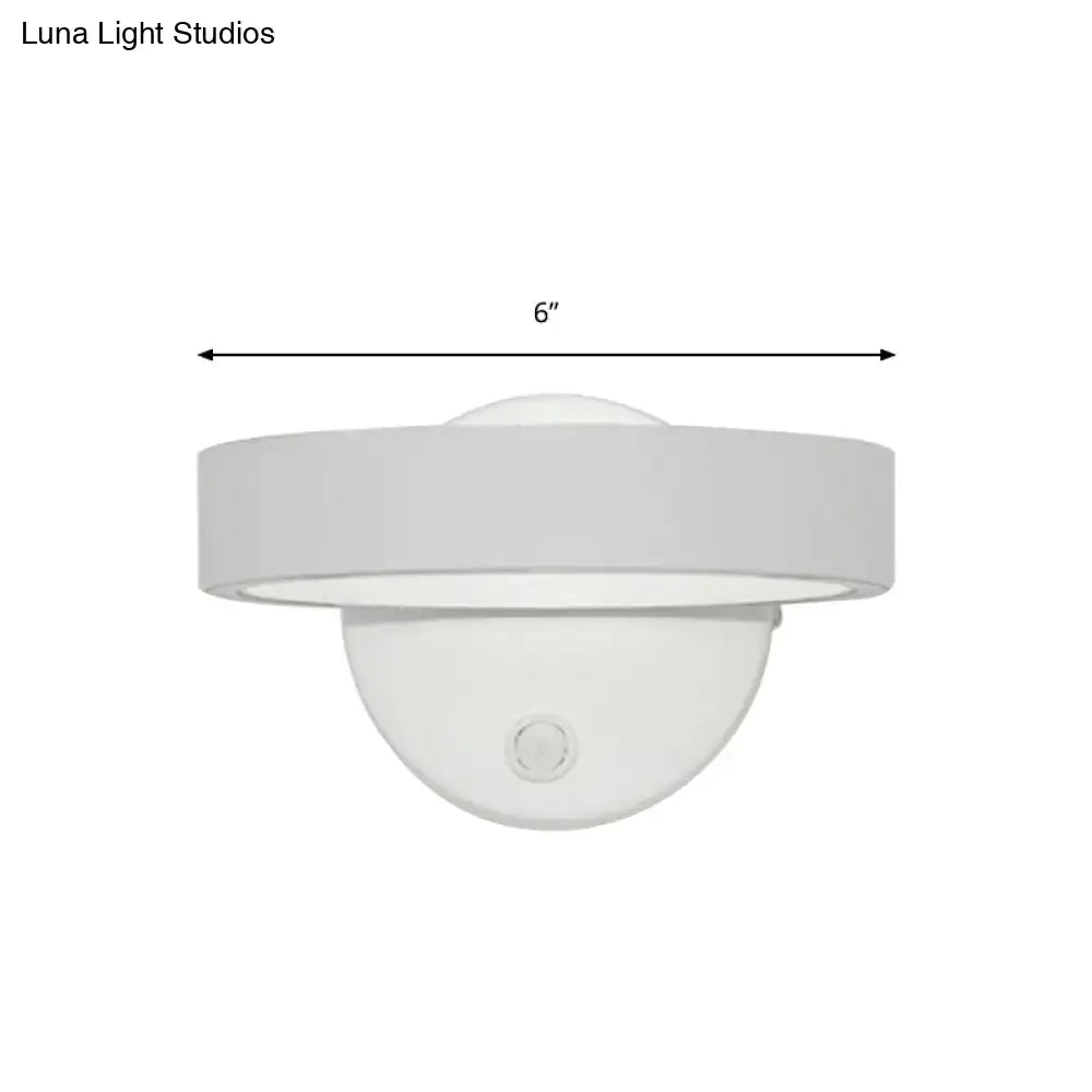 Modern white led wall sconce with sleek circular design 6-inch diameter direct wired bulb included for living room use