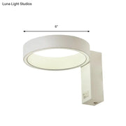 Modern white led wall sconce direct wired with a sleek circular design and 6-inch diameter power source for living room