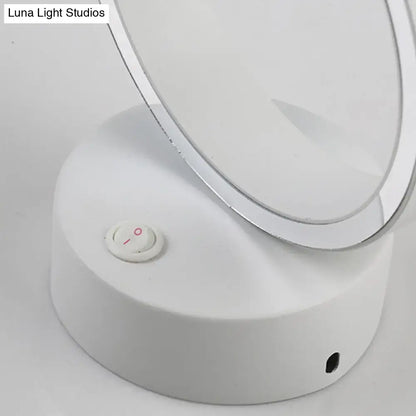 Modern white led wall sconce with a silver rim and integrated led light featuring a direct wired power source button