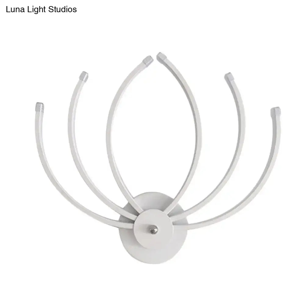 Modern white lotus wall sconce with curved slender arms radiating from a circular base ideal for bedroom lighting