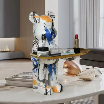 Modern white marble bear figurine sculpture painted in white blue and orange with a gold-trimmed tray for living room use