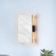 Modern white marble rectangular bedside wall sconce with sleek black bracket featuring a stylish design wall light