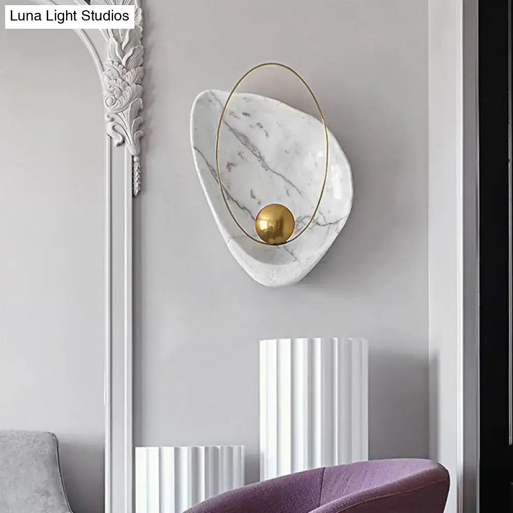 Modern white marble wall lamp with gold-toned metal frame and spherical accent fixture height suited for living room use