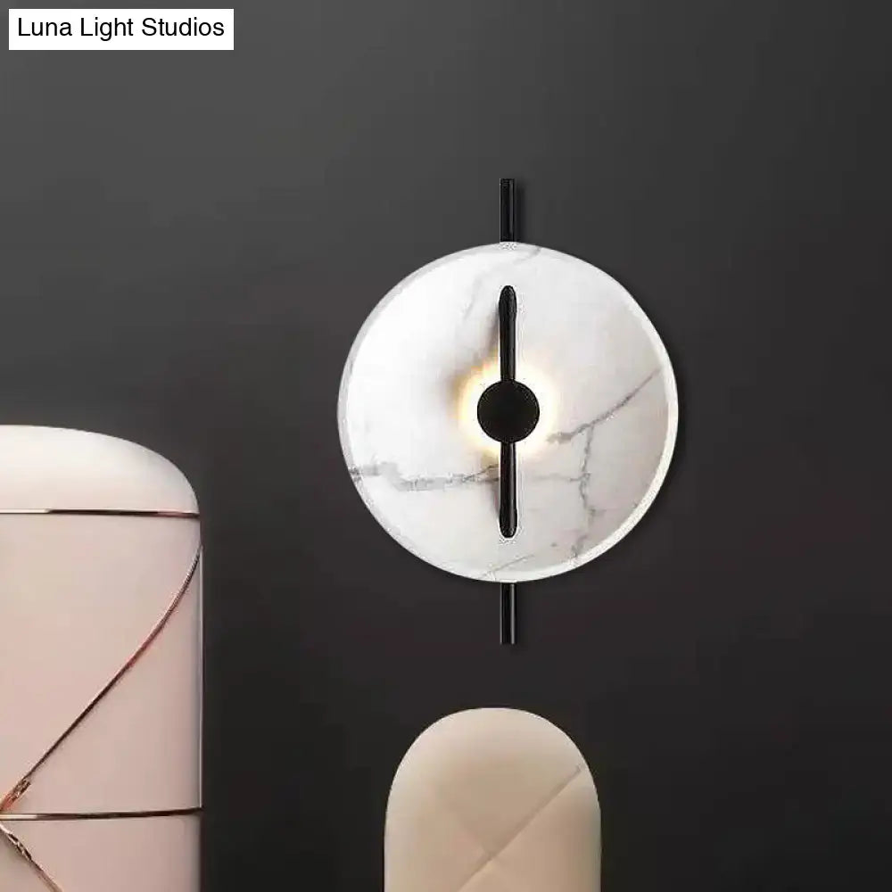 Modern white marble led wall sconce with circular face black metal accents bulb included fixture type bulb base