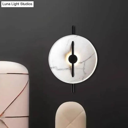 Modern white marble led wall sconce with circular face black metal accents bulb included fixture type bulb base