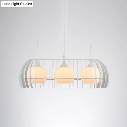 Modern white metal pendant light with three warm glass globe bulbs in cage frame for dining room island light fixture