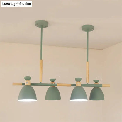 Modern green and wood-toned metal dome shade island chandelier with four dome-shaped shades for kitchen islands