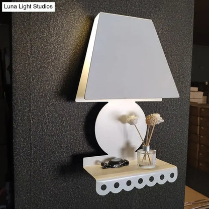 Modern white metal trapezoid wall sconce light with scalloped shelf for bedroom use