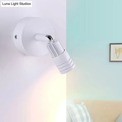 Modern white metal wall mounted led spotlight with adjustable design and metallic accents for bedroom reading light fixture