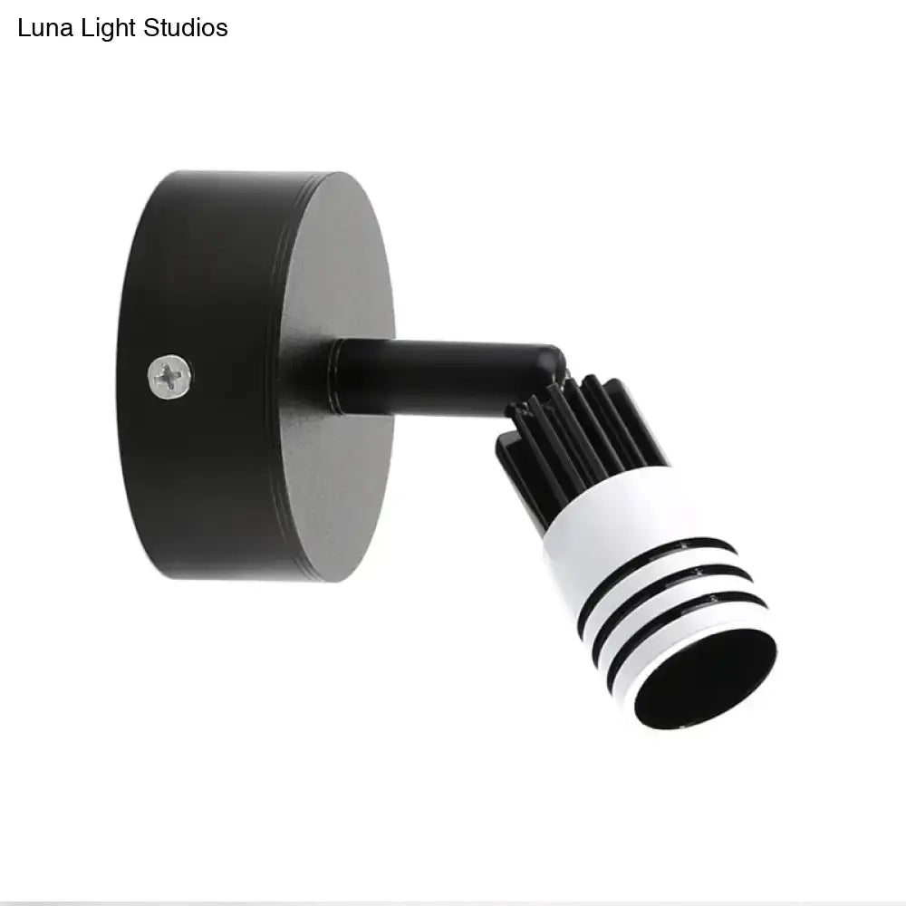 Modern white metal wall mounted led spotlight with adjustable black and white cylindrical head for bedroom reading light