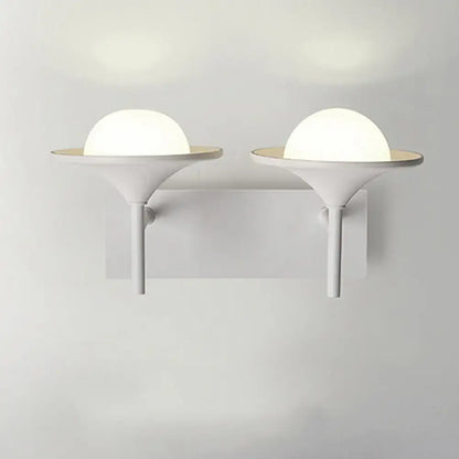 Modern white metallic flared wall sconce with frosted glass dome and sleek base for bedroom LED lighting